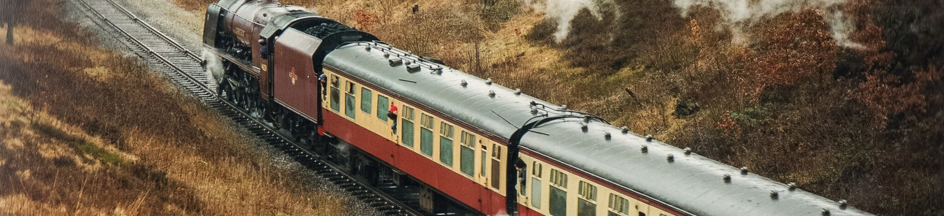 A train on the East Lancashire Light Railway emitting a plume of smoke.