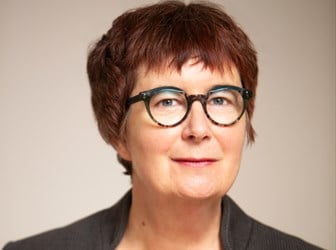 A head and shoulders portrait photograph of Alison Oram